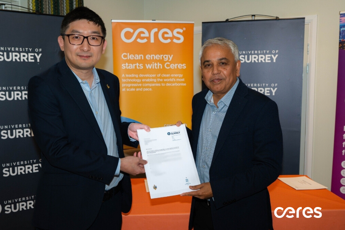 Professor Jin Xuan and Dr Subhasish Mukerjee displaying Dr Mukerjee's appointment letter